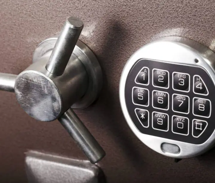 Close-up of a safe’s electronic keypad and handle