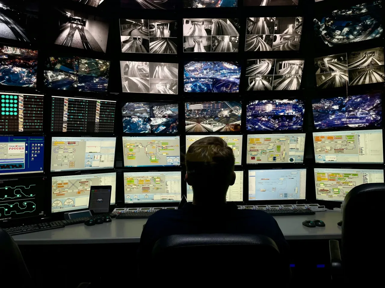 Operator reviewing multiple transit surveillance-camera feeds
