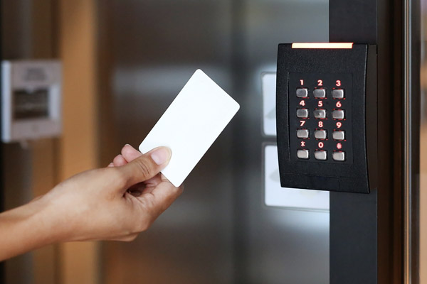 Access card being presented to a commercial door reader