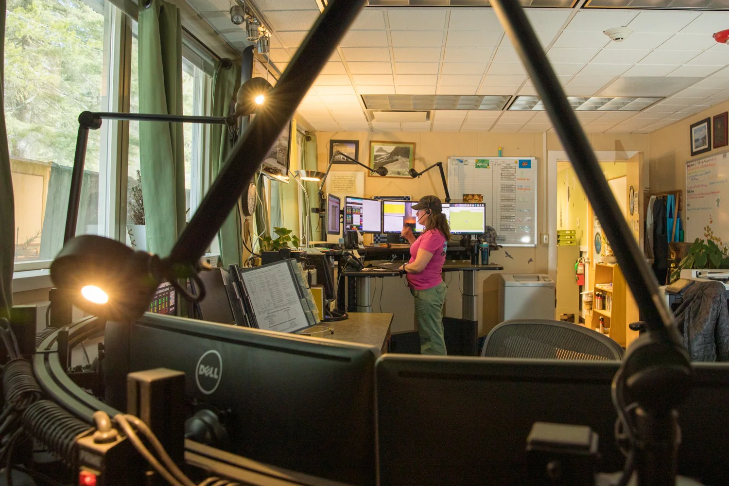National Park Service dispatcher coordinating a response from a multi-monitor workstation