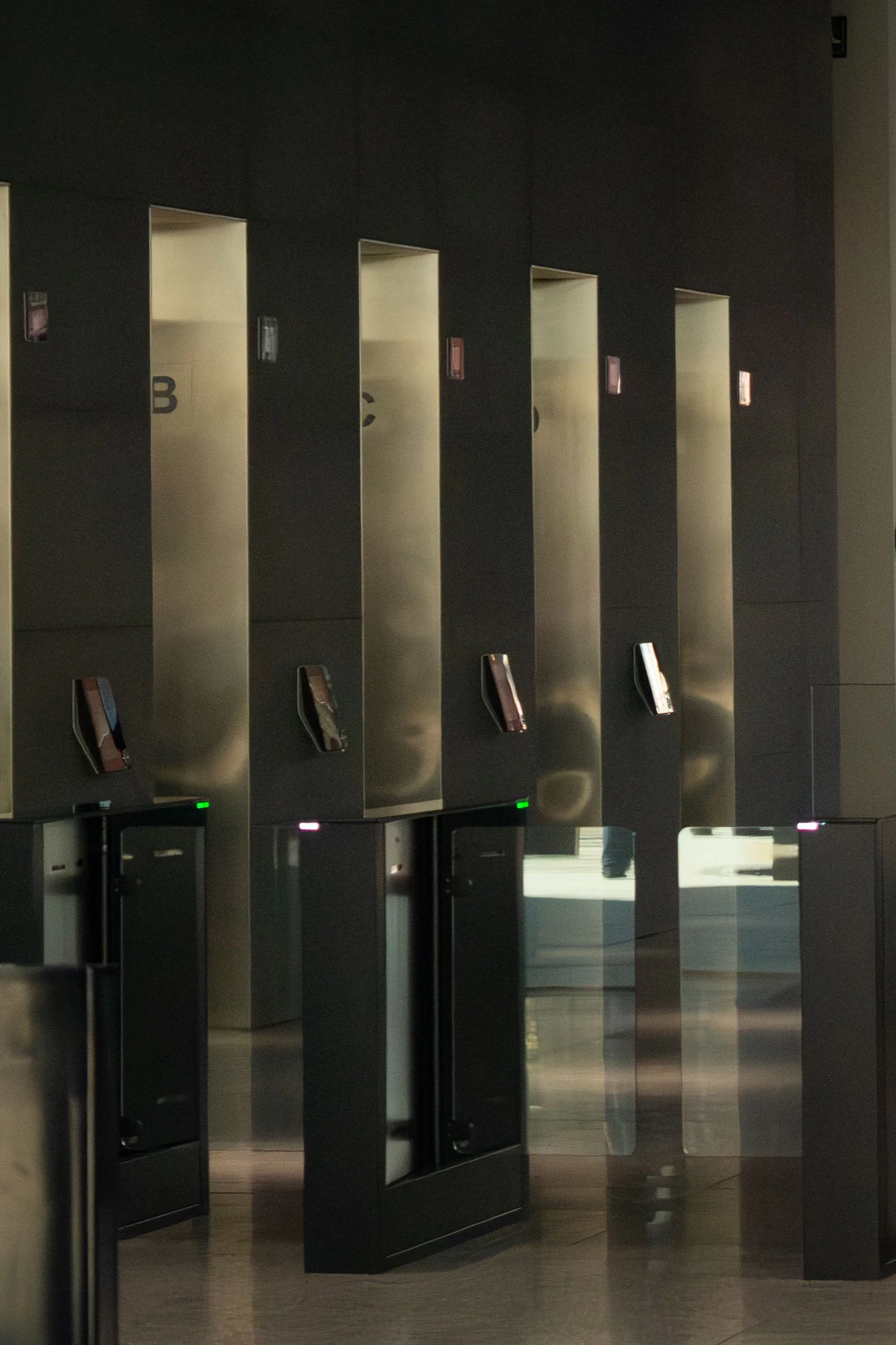 Access-controlled turnstiles in a modern office lobby
