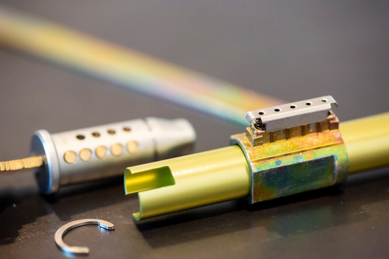Disassembled pin-tumbler cylinder showing the internal pins