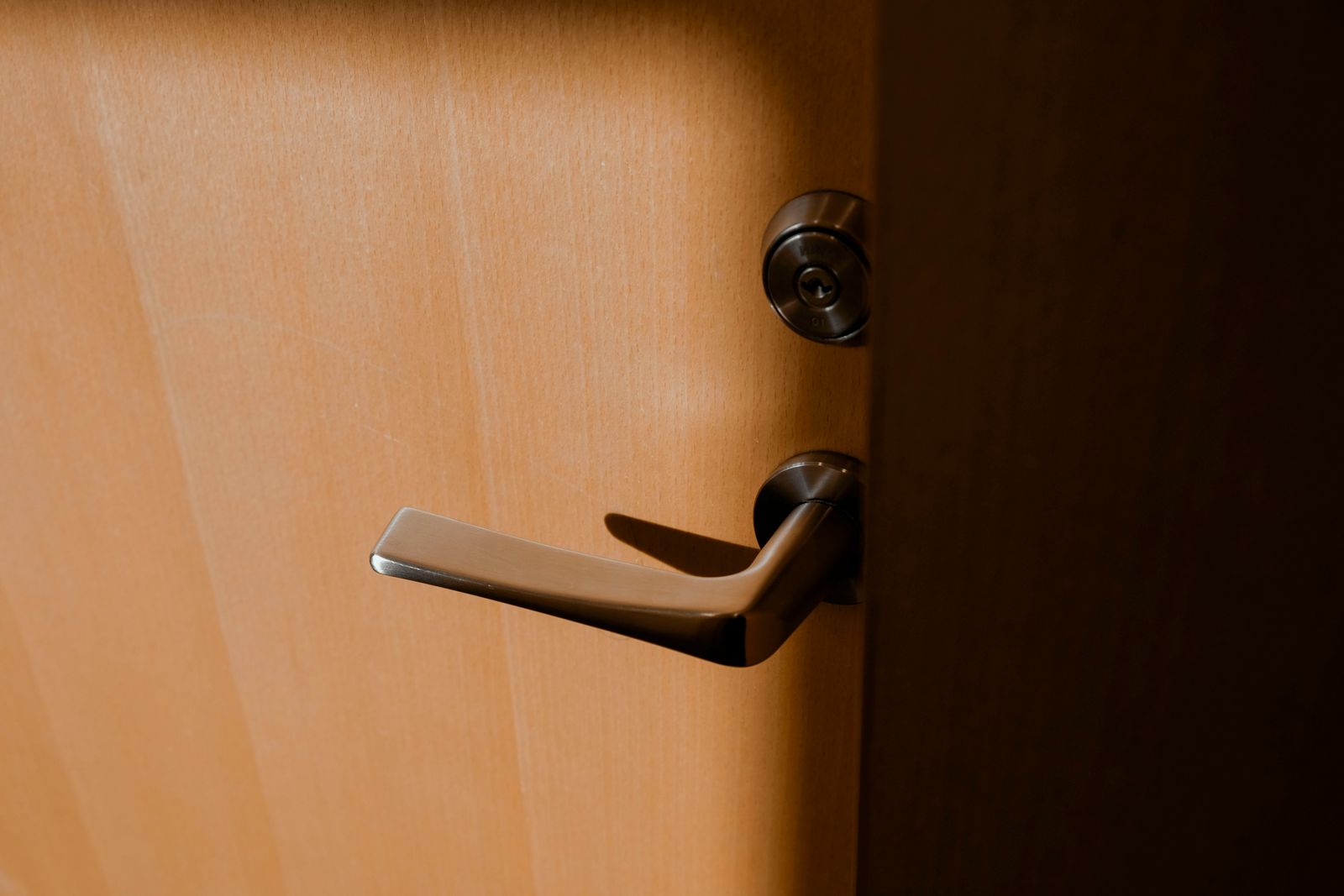 Residential door with a keyed deadbolt and lever handle