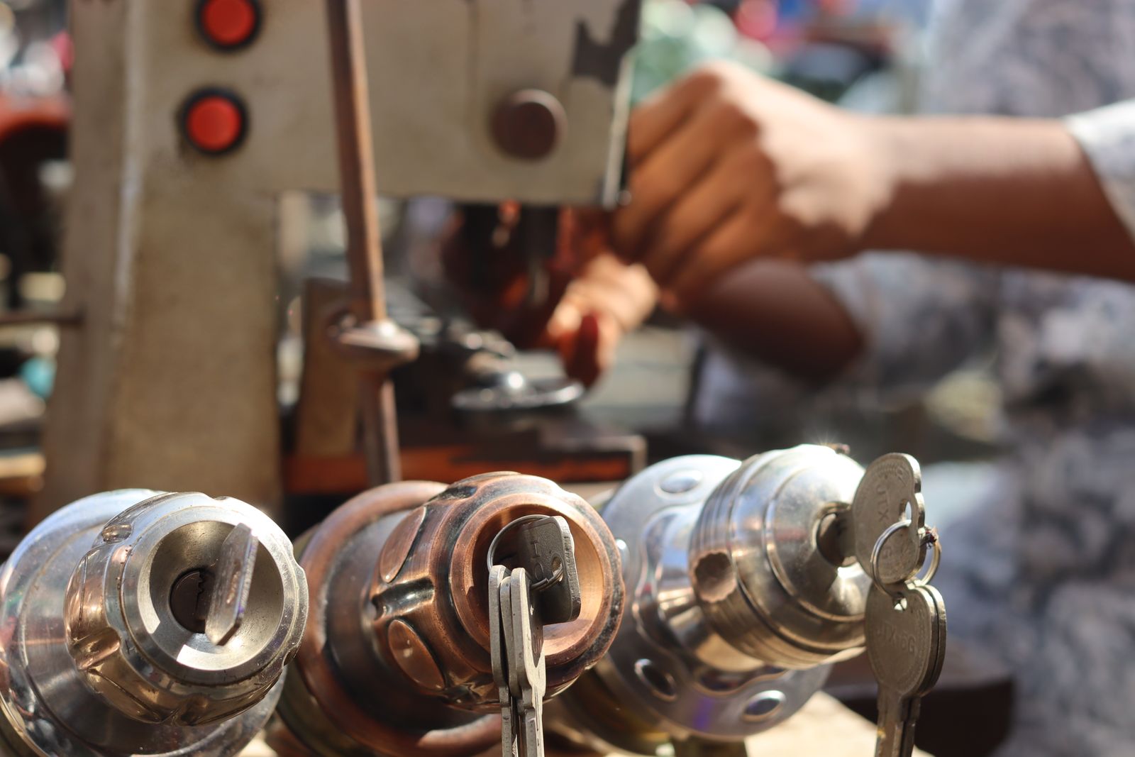 Lock cylinders and key-cutting equipment in a locksmith workshop